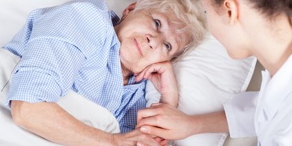 Elderly woman in bed